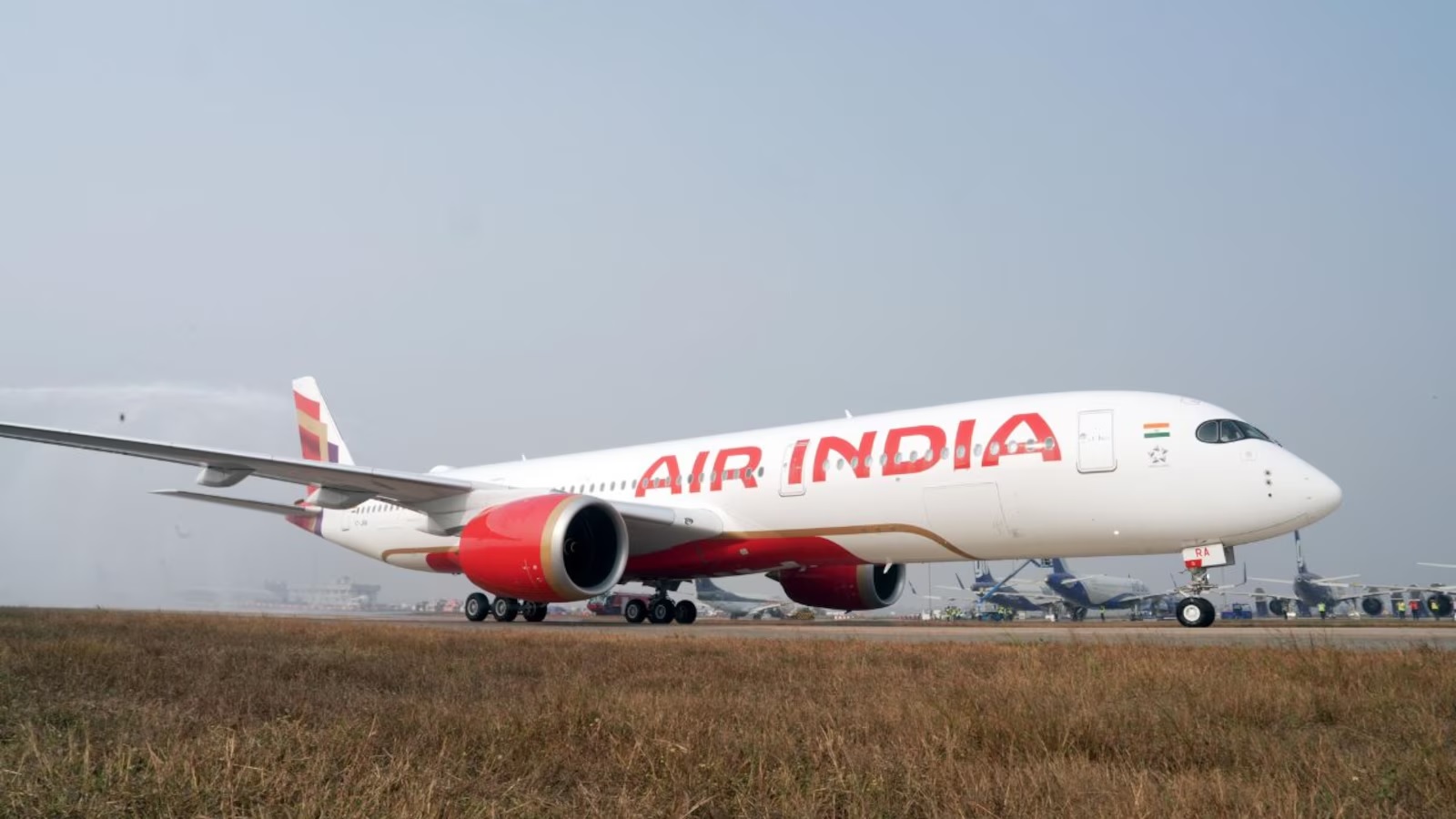 an air india flight experienced a collision with a tug tractor while taxiing toward runway 2