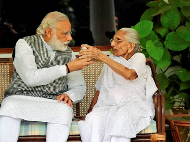 supporters carrying pm modi mother photo during a political rally in hooghly 1