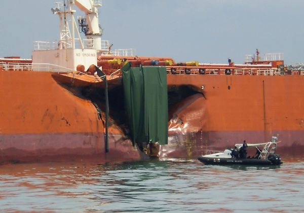 boat collides with fuel vessel in singapore spilling of several gallons of oil into the sea1