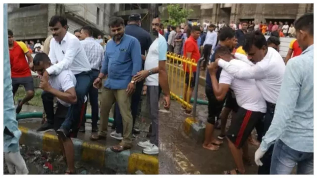 deputy mayor climbed on shoulders of officer so that his feet do not get dirty in mud 1