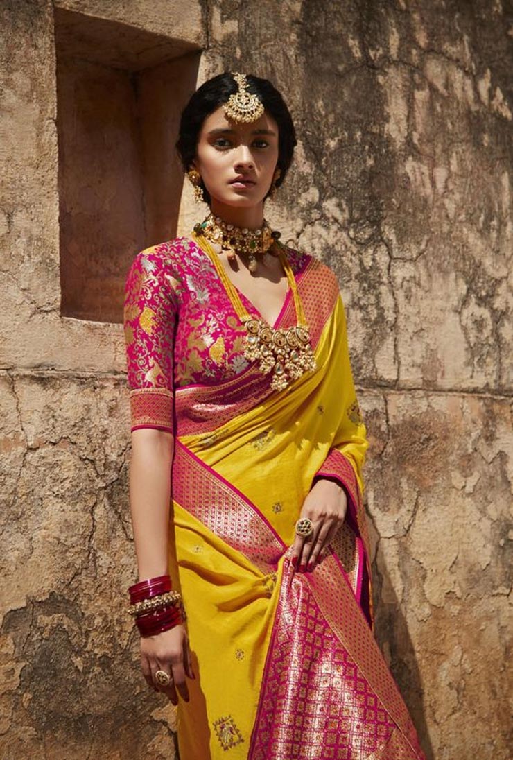 yellow saree style with pink blouse 1726833421489