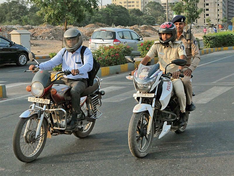 it is mandatory for police and civil staff to wear helmets in ahmedabad city otherwise1